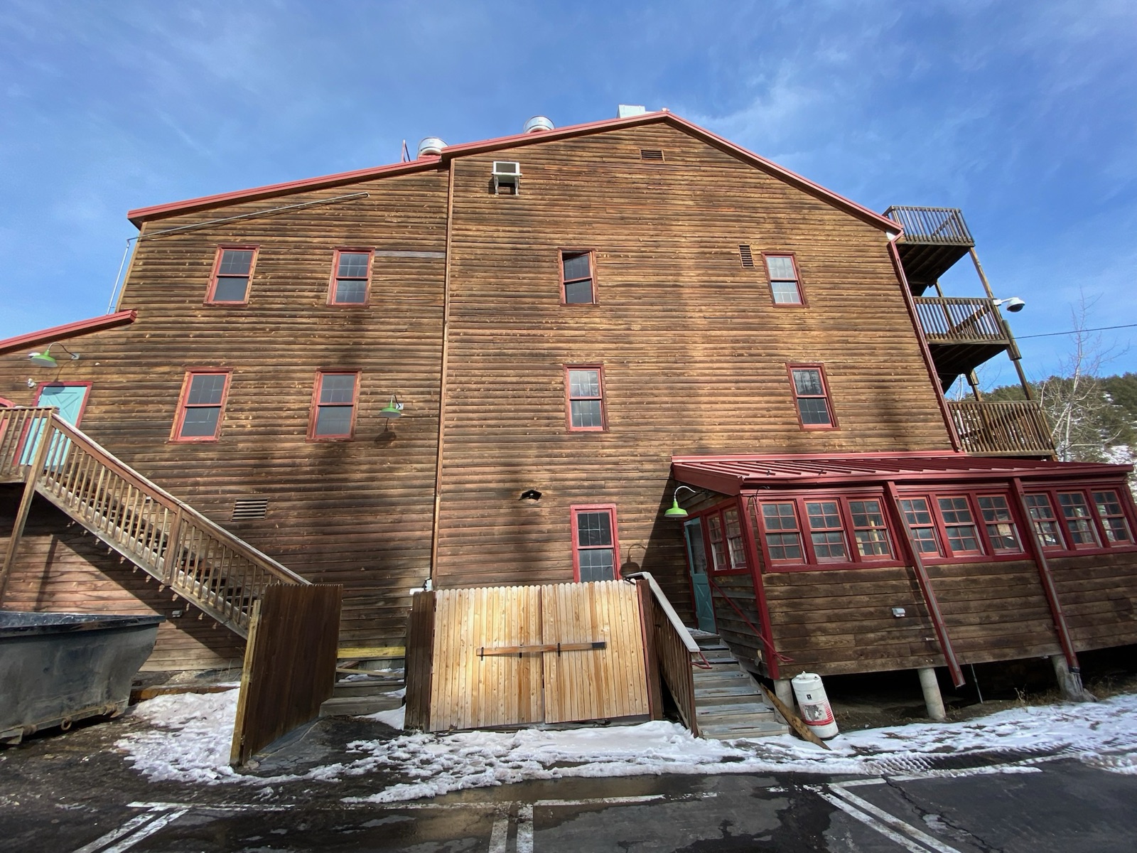 Weathered barn exterior where reclaimed lumber originates